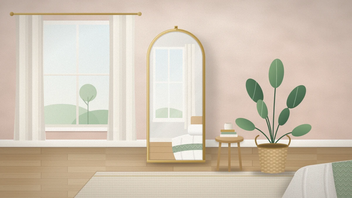 Small bedroom corner with a tall arched floor mirror in a thin brass frame leaning beside a window, reflecting daylight, a bed corner and a potted plant