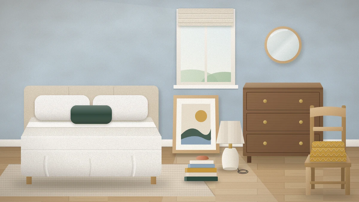 Small bedroom mid-refresh in daylight with a freshly made bed, a framed print leaning on the wall, a lamp and books on the floor by a cleared dresser