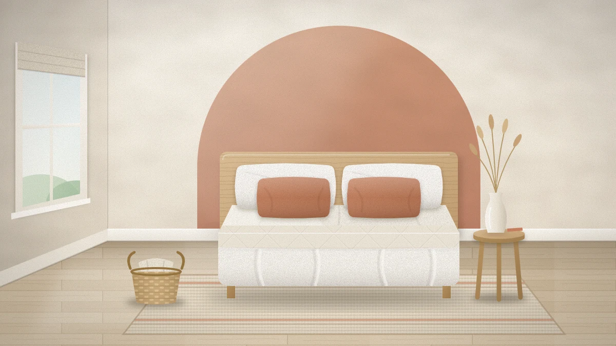 A small bedroom with a muted terracotta arch painted behind a bed with white bedding and terracotta cushions, the other walls warm white
