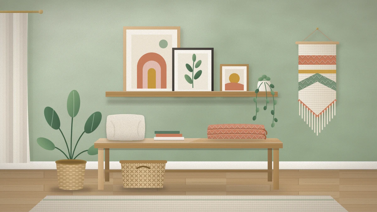 Bedroom wall above a low wooden bench with a narrow picture ledge holding three leaning framed prints, a trailing plant and a woven wall hanging